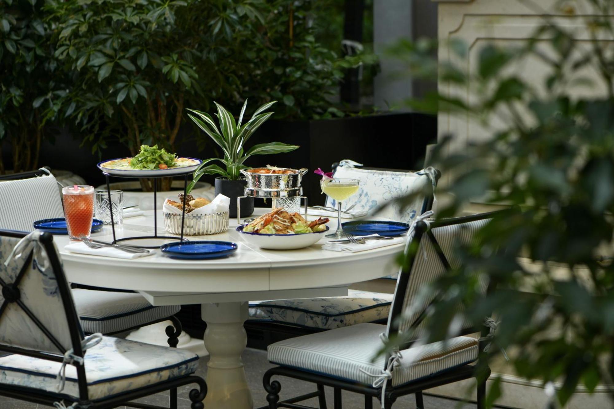 Banyan Tree Doha At La Cigale Mushaireb Экстерьер фото A table set for afternoon tea at the Mandarin Oriental, Paris